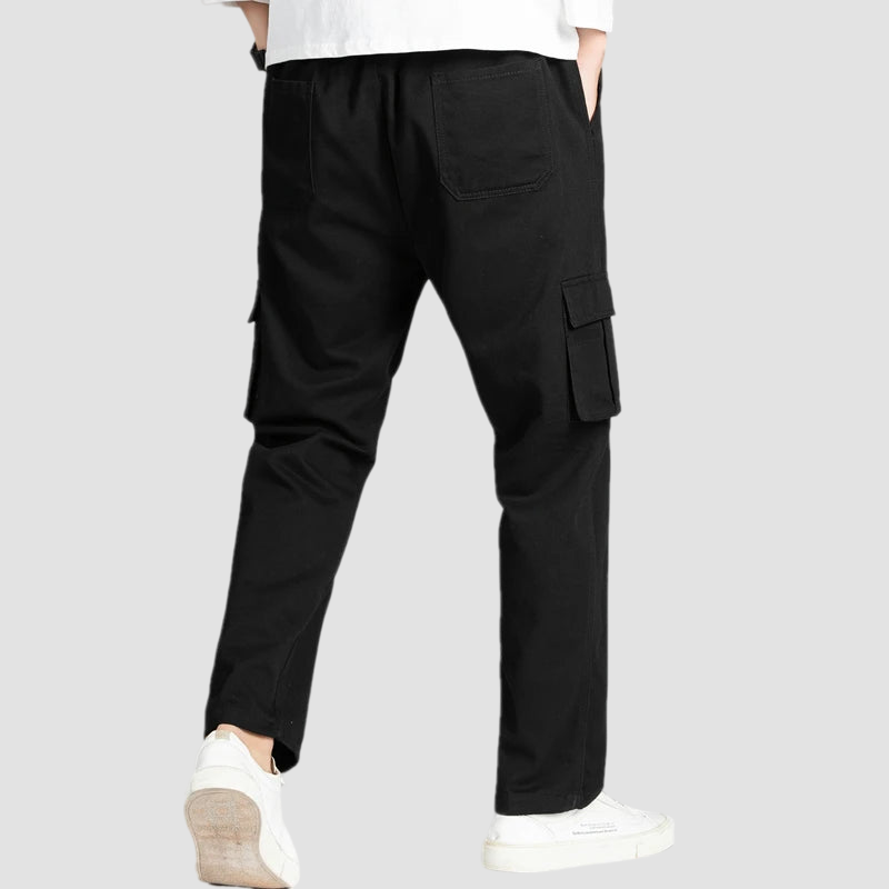 a man in white shirt and black pants