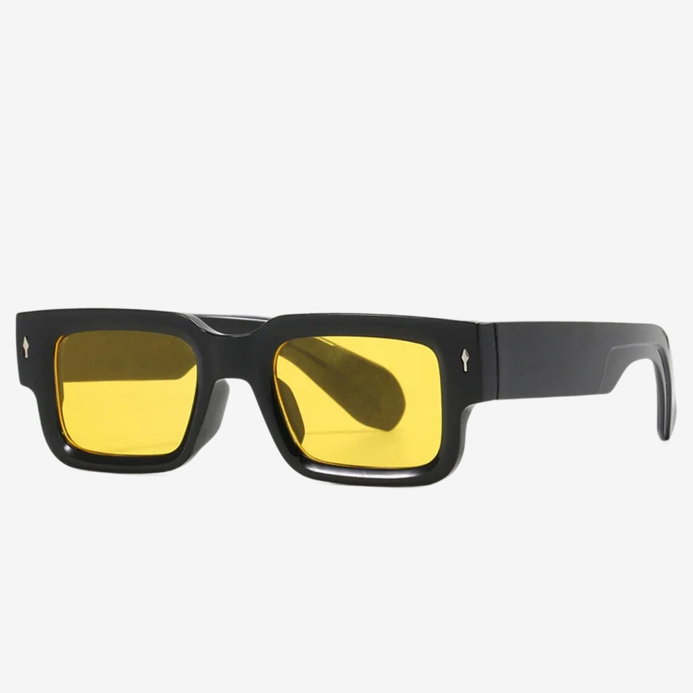 a pair of black sunglasses with yellow lenses