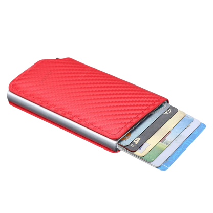 a red wallet with four credit cards in it