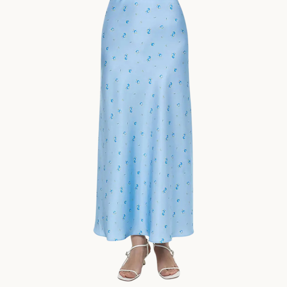 a woman wearing a blue skirt and sandals