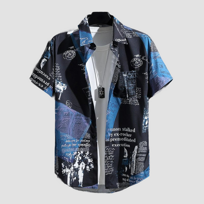 a blue shirt with black and white designs on it