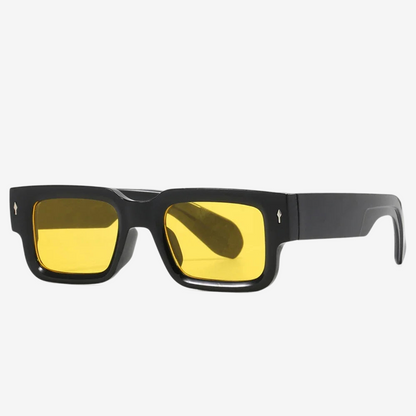 a pair of black sunglasses with yellow lenses