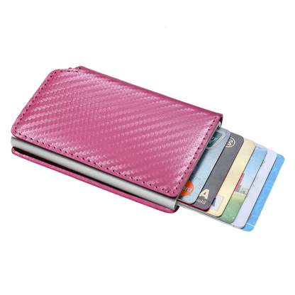 a pink leather wallet with credit cards in it